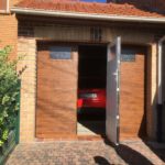 La porte de garage sectionnelle avec portillon intégré